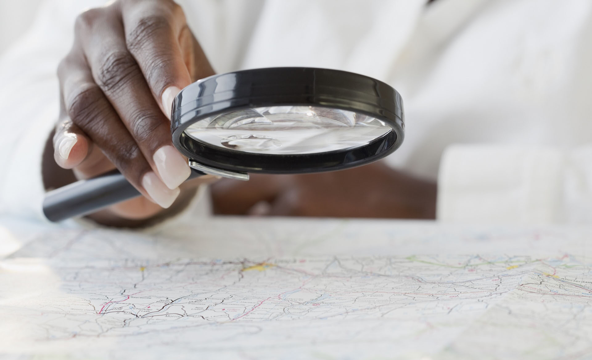 Woman holding magnifying glass